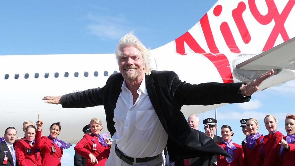 Richard Branson, founder of Virgin Group, smiling in a business setting